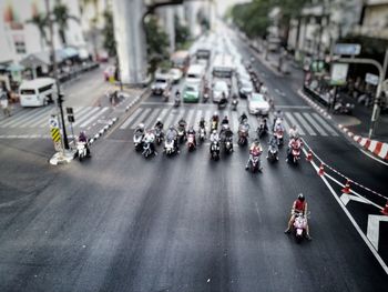 High angle view of people waiting on road during signal