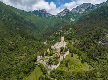 High angle view of trees and mountains against sky