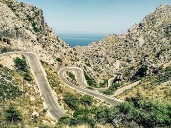 Scenic view of mountain road against sky