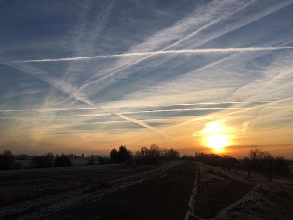 sky, sunset, cloud - sky, landscape, environment, scenics - nature, tranquility, tranquil scene, road, beauty in nature, no people, nature, sun, rural scene, land, orange color, dirt, transportation, idyllic, field, vapor trail, outdoors, bright