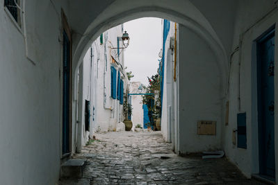 Archway amidst buildings in city