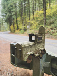 Close-up of old telephone booth in forest