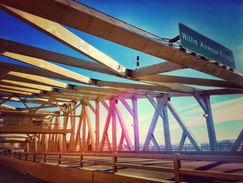 Low angle view of bridge against blue sky