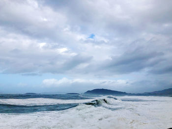 Scenic view of beach against sky