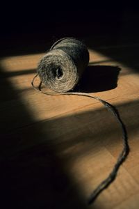 Close-up of electric bulb on table