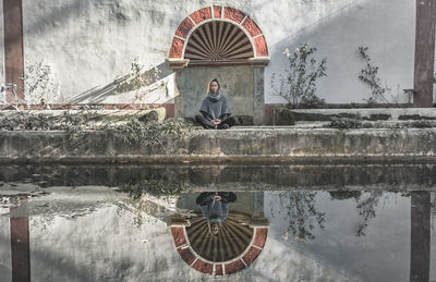 Reflection of woman meditating