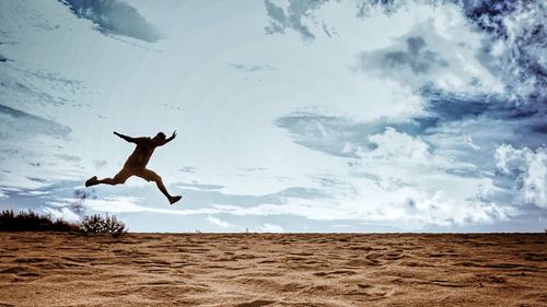 Man jumping in desert