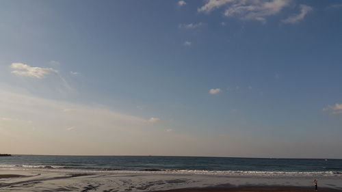 Scenic view of beach against sky during sunset