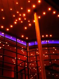 Low angle view of illuminated building at night