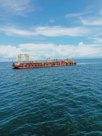 Ship in sea against sky