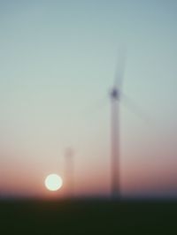 Scenic view of field against clear sky during sunset