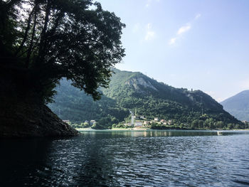 Scenic view of lake and mountains against sky