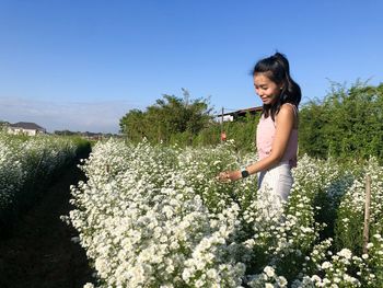 Full length of woman standing on land against clear sky