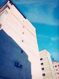 High angle view of swimming pool by building against sky