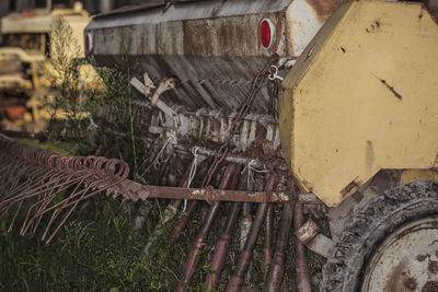 Close-up of rusty machine part of abandoned car