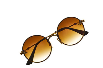 Close-up of sunglasses against white background