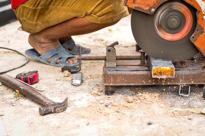 Man working on barbecue grill