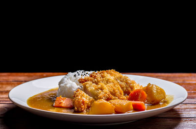 Close-up of food served on table