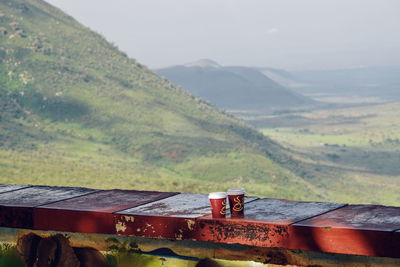 Coffee drinks against a mountain background, rift valley view point