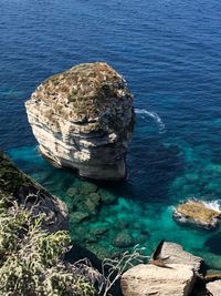 High angle view of rock formation in sea