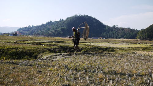 Farmer working on landscape