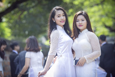 Portrait of friends standing outdoors