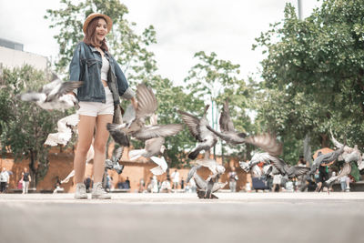 People on birds in park