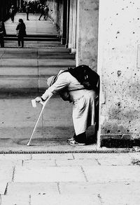 Man working on footpath