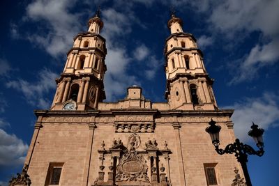 Low angle view of church against blue sky