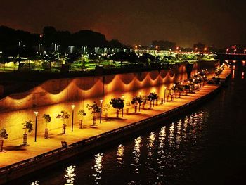 Reflection of illuminated buildings in water