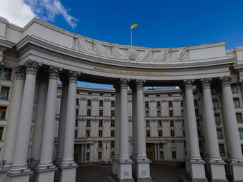 Low angle view of building against blue sky