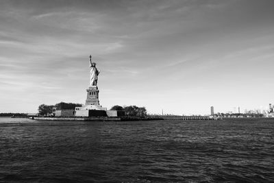 Statue of liberty with city in background