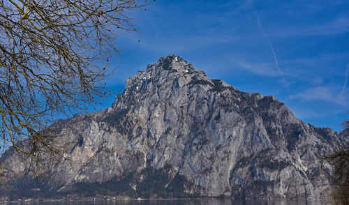 Low angle view of rock formation against sky