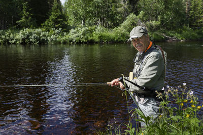 Man fishing in river