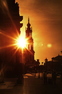 Group of people in city during sunset