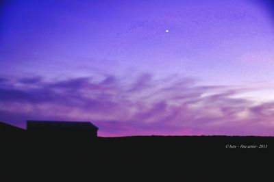 Low angle view of built structures at dusk