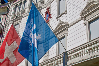Low angle view of buildings against blue sky