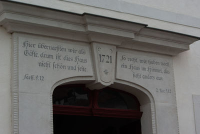 Low angle view of text on building