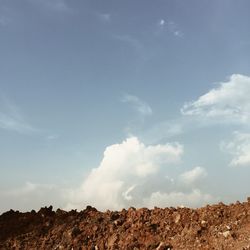 Scenic view of landscape against cloudy sky