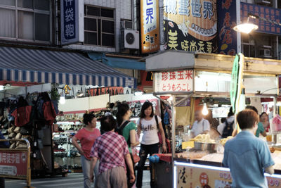 People on street market in city