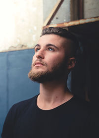 Close-up of young man looking away