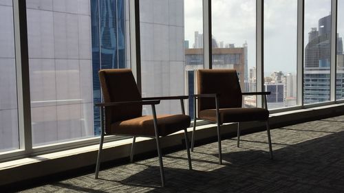 Two empty chairs before a meeting 