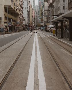 Surface level of street amidst buildings in city