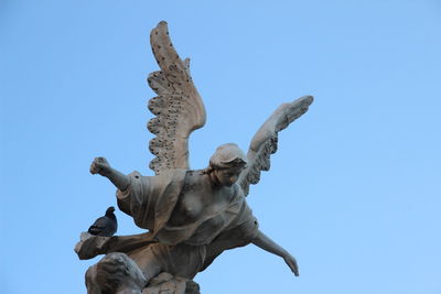 Low angle view of statue against clear sky