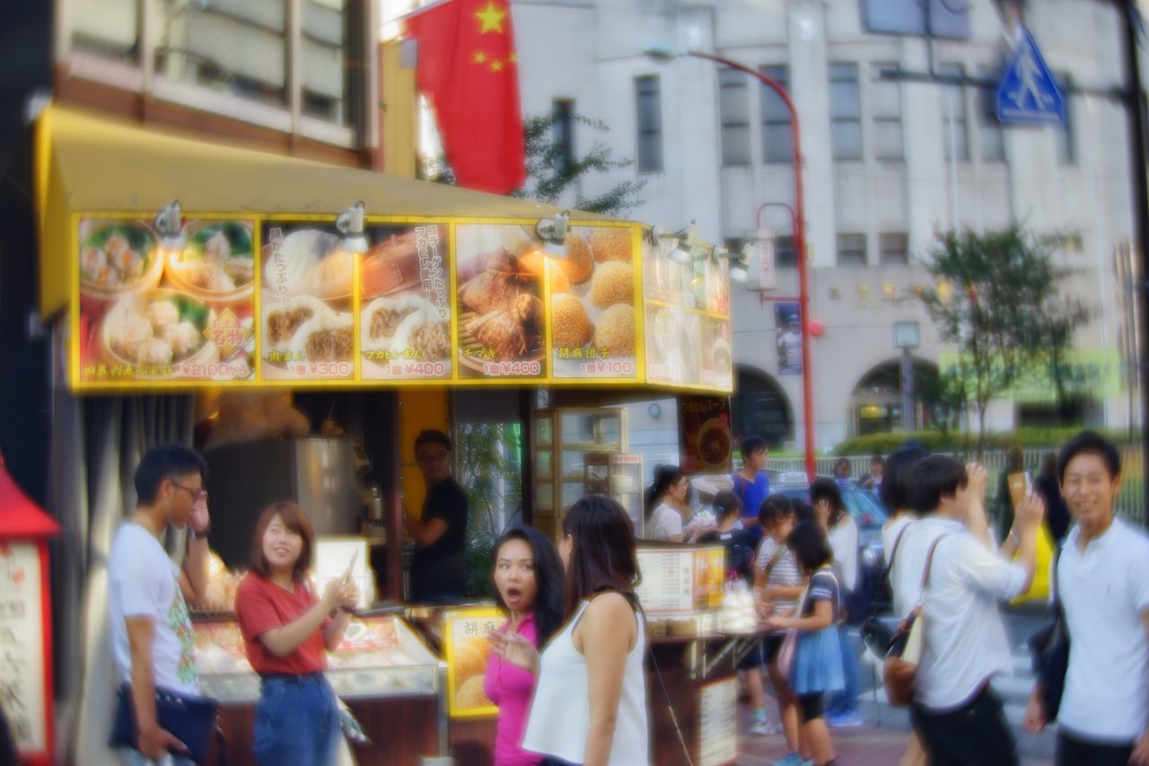 large group of people, men, leisure activity, person, lifestyles, food and drink, food, building exterior, city, focus on foreground, retail, collection, crowd, city life