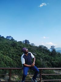 Full length of man on mountain against sky