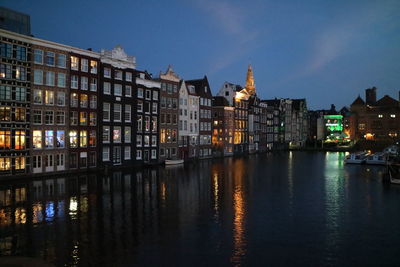 Reflection of illuminated buildings in water at night