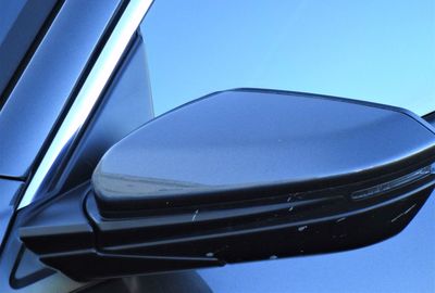 Close-up of car against blue sky