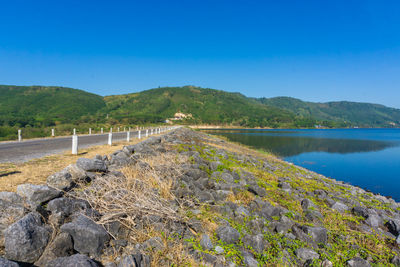 Scenic view of mountains against clear blue sky