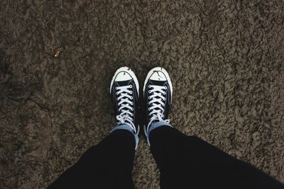 Low section of person standing on ground